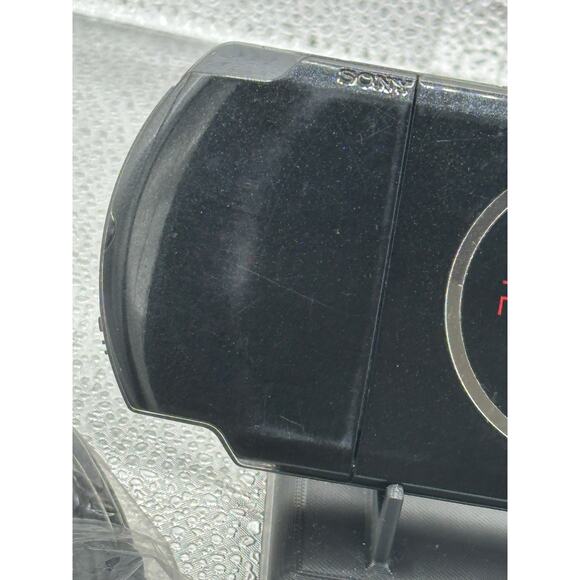 Red and black psp 3000 w/charger adapter, new battery & has glass screen lens - Picture 7 of 9